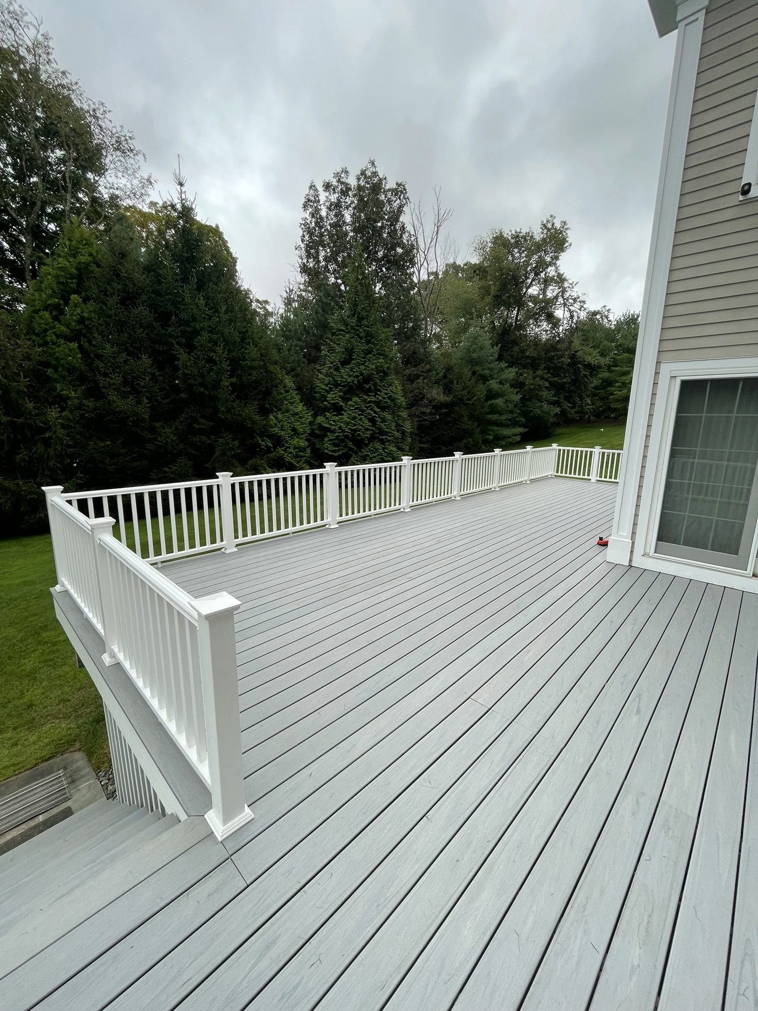 After: large composite deck overlooking backyard — Westchester County NY