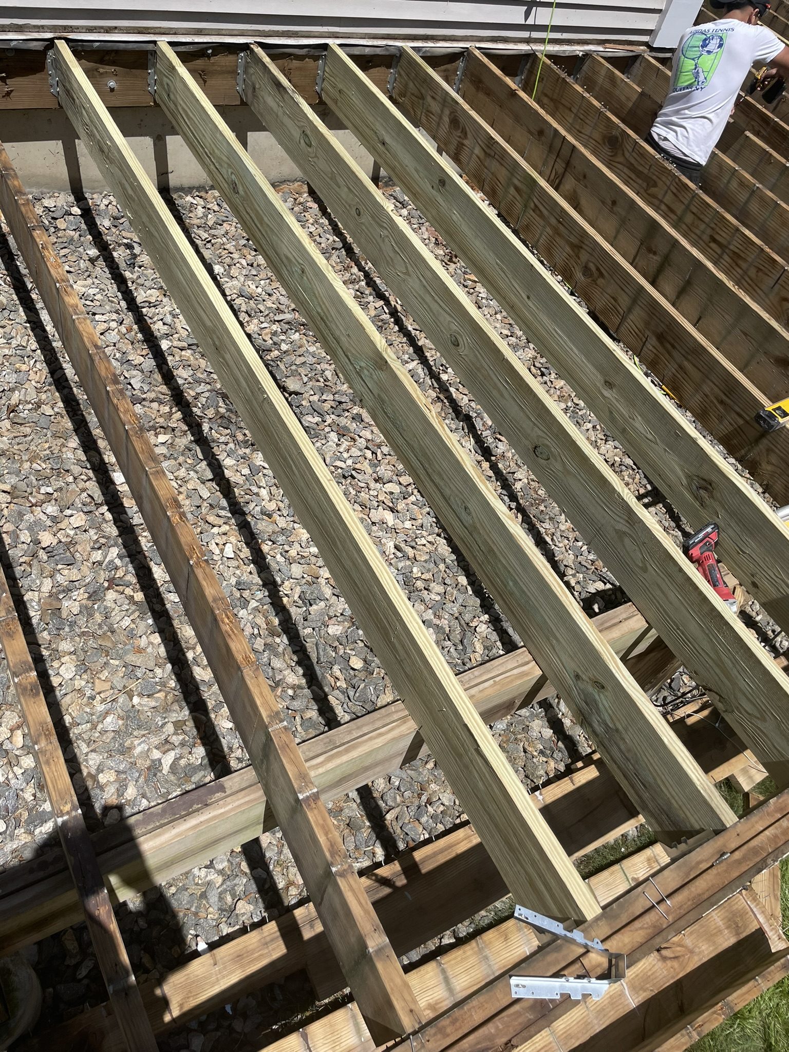 During: new deck subframe and ledger board construction