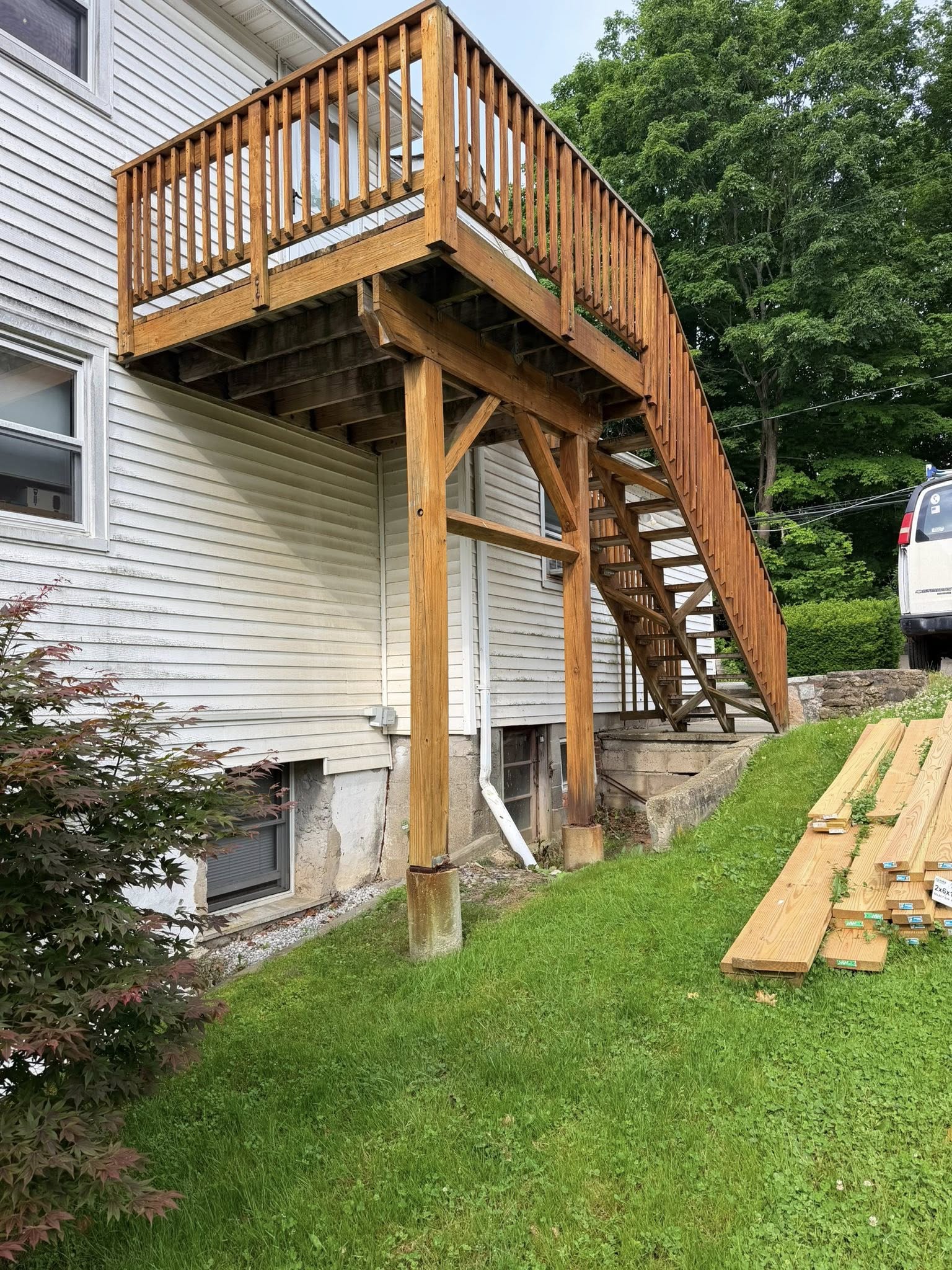 Before: deteriorated wood staircase with rotted steps and old weathered lumber — Westchester NY