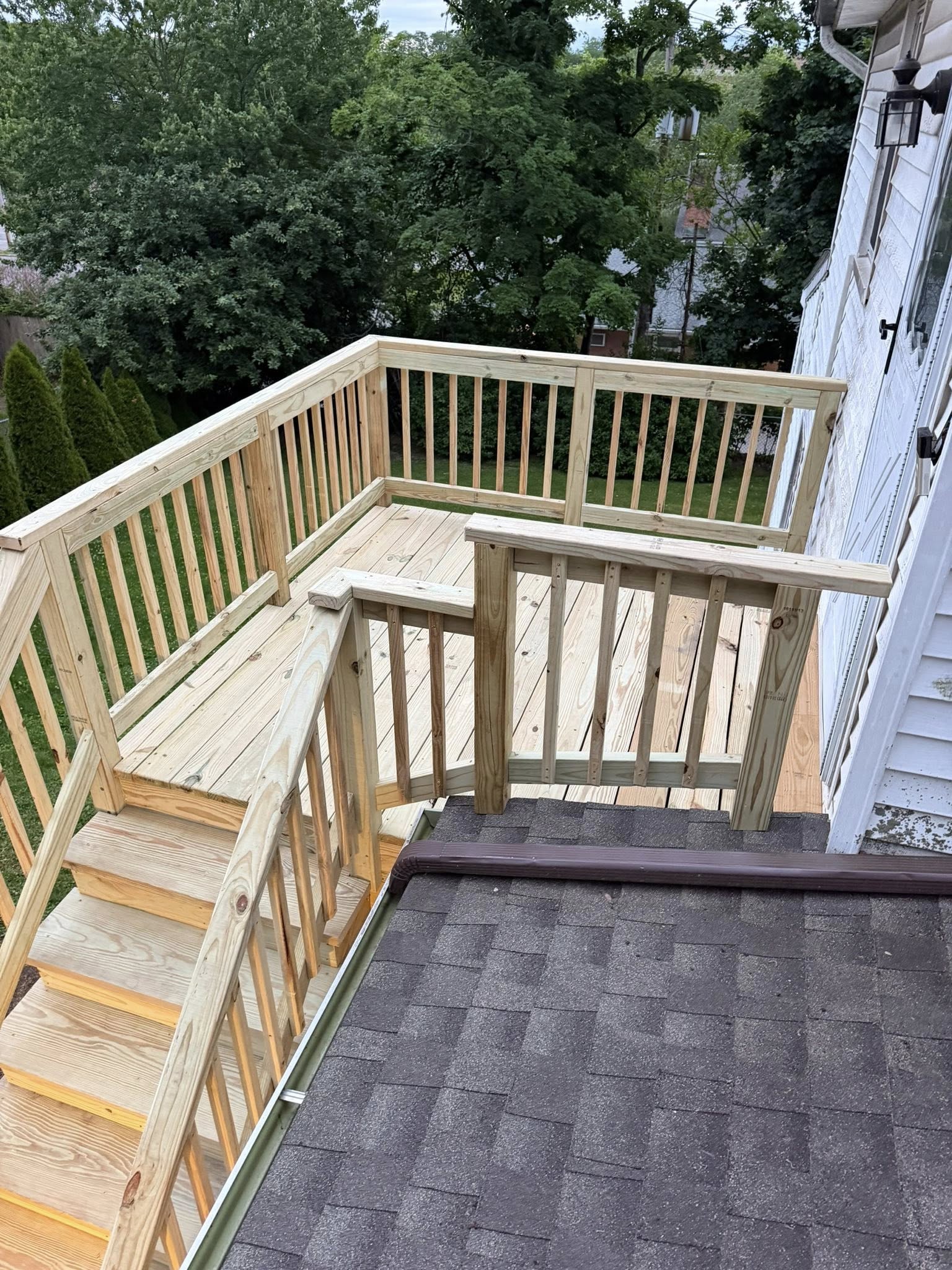 New second floor deck with built-in bench seating and railing — Westchester NY