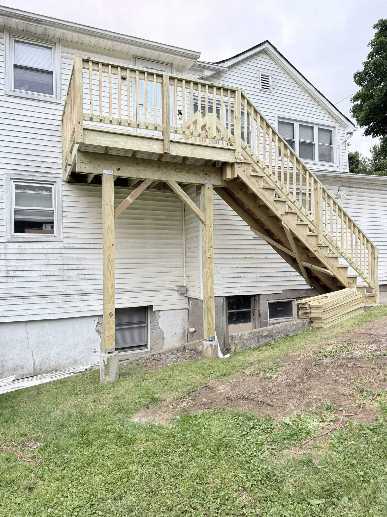 Completed second floor deck and full staircase — new pressure treated lumber Westchester NY