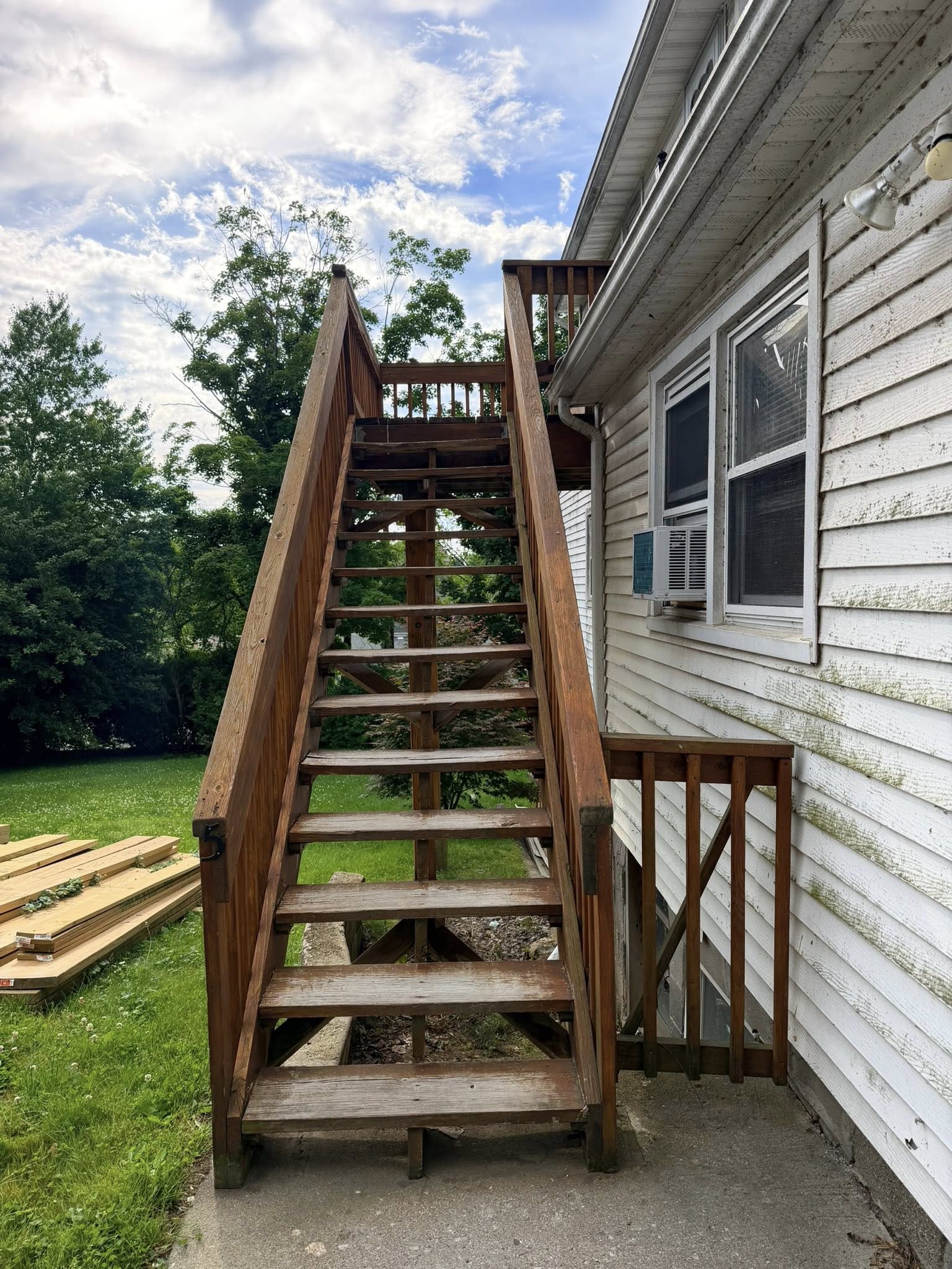 Before: old deteriorated deck staircase — weathered wood Westchester NY
