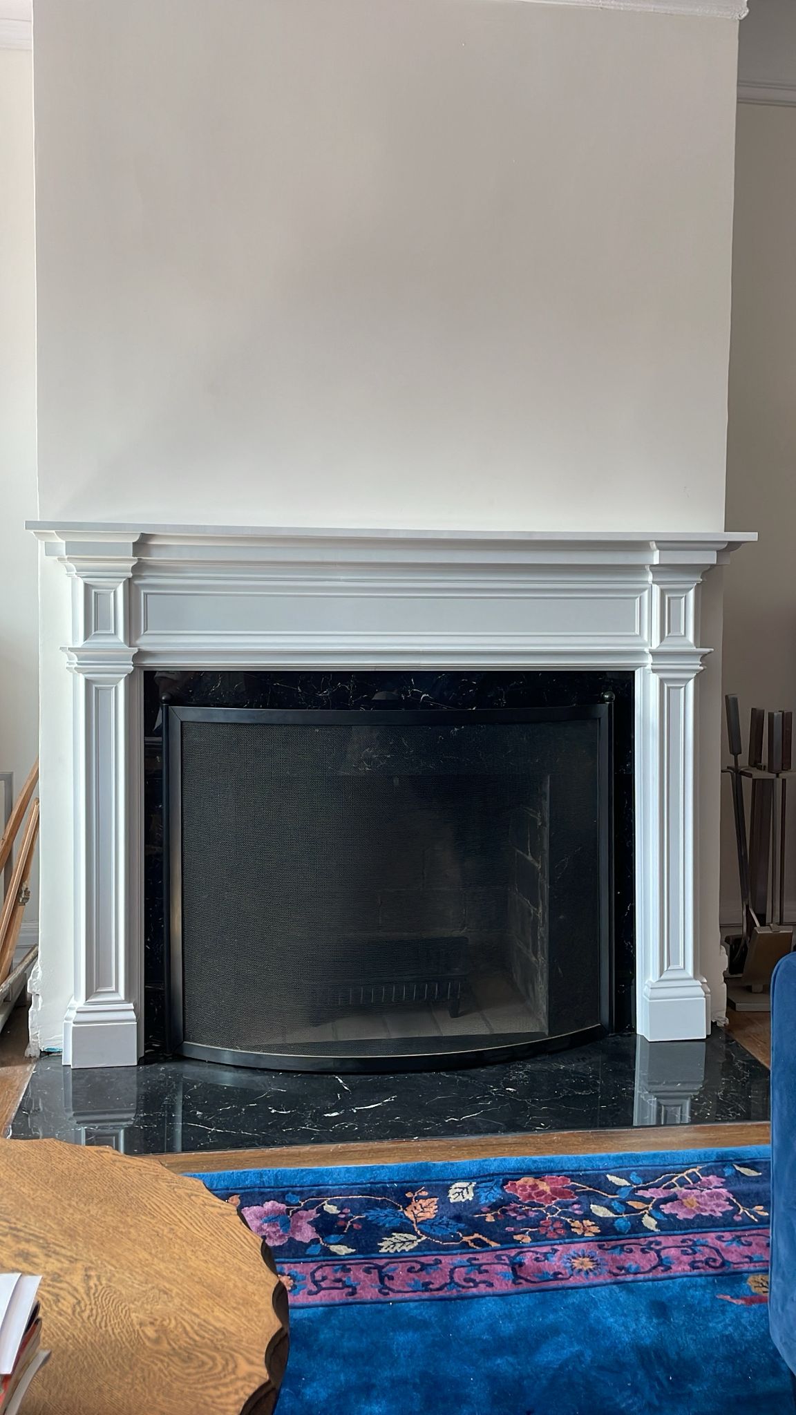 Installed: custom mantel over the original Nero marble surround — custom fireplace mantel, Westchester NY
